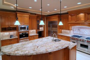 Newly remodeled kitchen with wood cabinets and large island