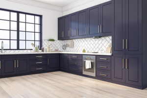 A remodeled kitchen with dark blue cabinets, light-colored flooring, and white walls