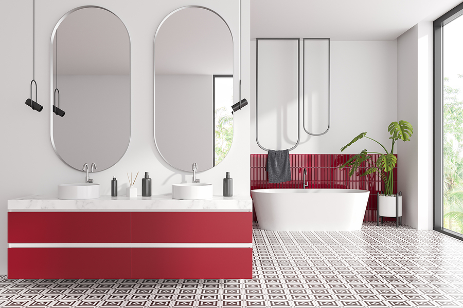 A red and white bathroom with a double vanity and separate tub and shower